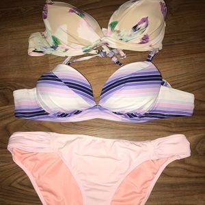 Two push-up bathing suit tops with a bottom